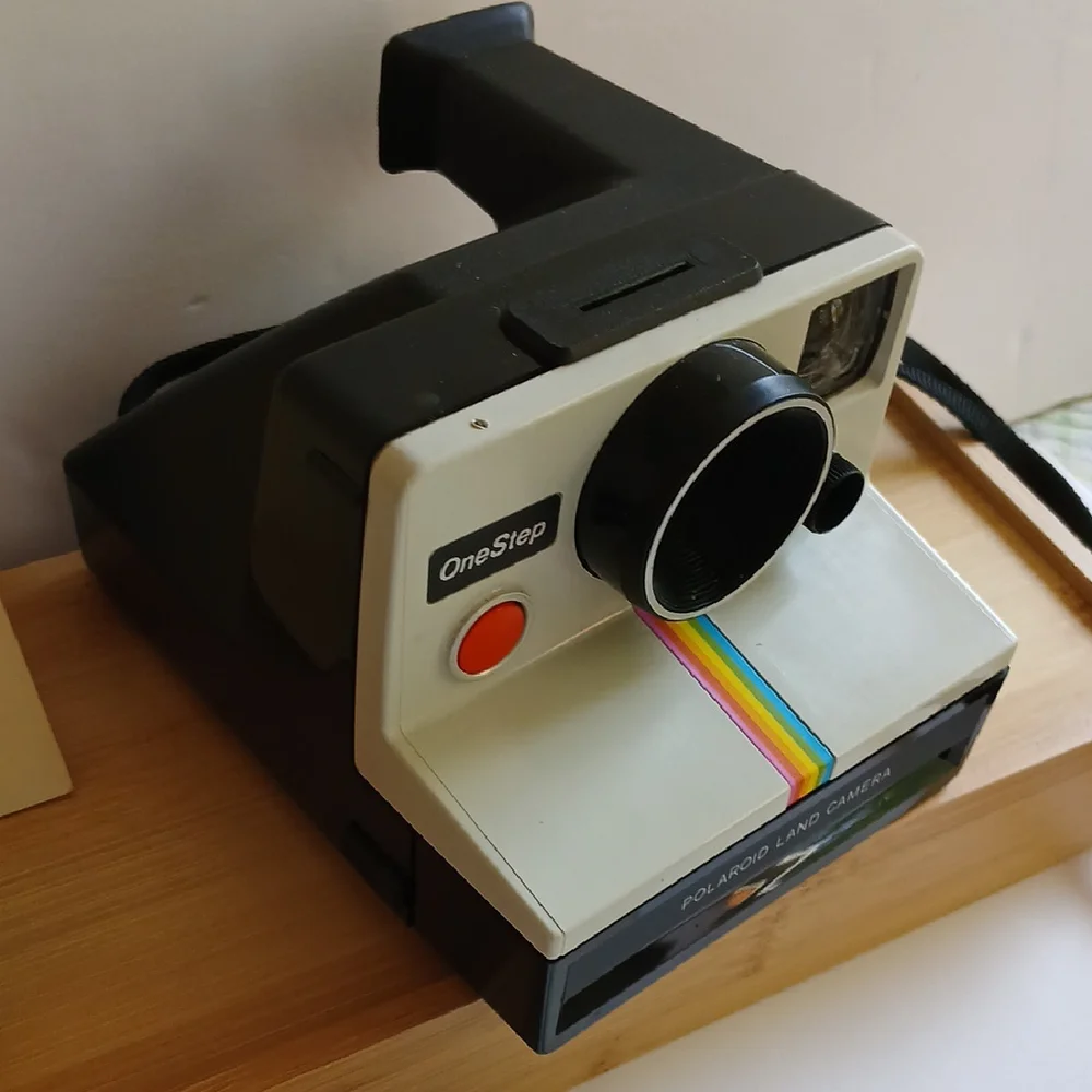 Vintage Polaroid Land One Step Instant Film Camera with Iconic Rainbow Design